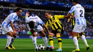 CARAS DA COPA: JAMES RODRÍGUEZ Grande arma do Dortmund, Mario Gotze foi muito marcado pelo Málaga